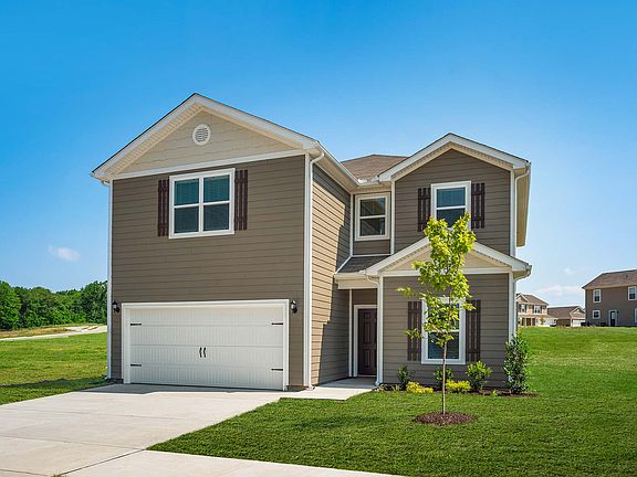 The Driftwood features 5 bedrooms, 2.5 baths, a large gameroom, and a two-car garage