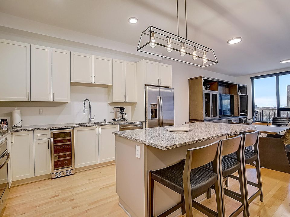 Modern living with replaced appliances, built in custom entertainment and desk area, with motorized blinds in all windows and doors