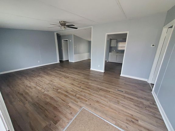 View from the front door. Living room, leading into dining room.