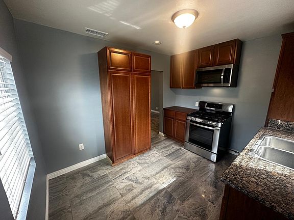 Kitchen space with Range and Microwave included, space for your fridge and breakfast table.
