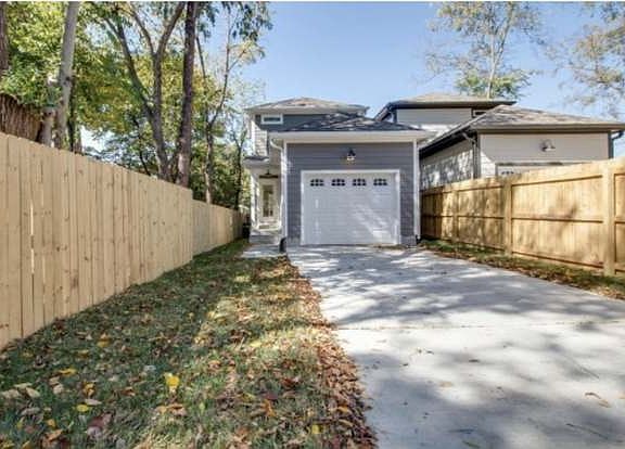 Gated driveway with lawn