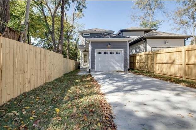 Gated driveway with lawn