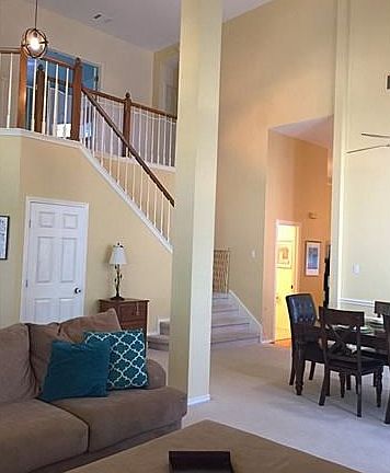 Spacious Living and Dining area!  Love these tall ceilings!
