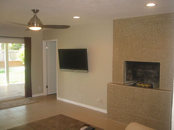 Family room w/ custom glass mosaic fireplace
