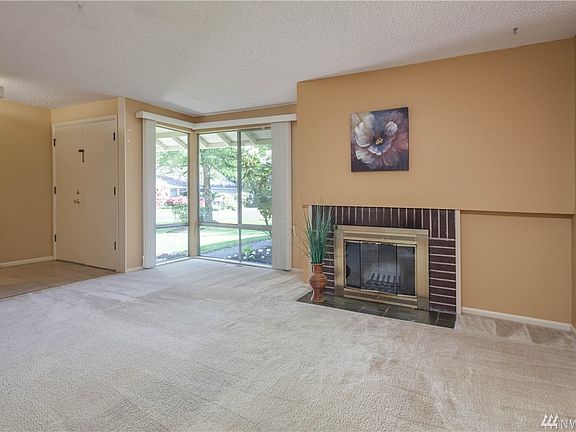 Living room with wood-burning fireplace