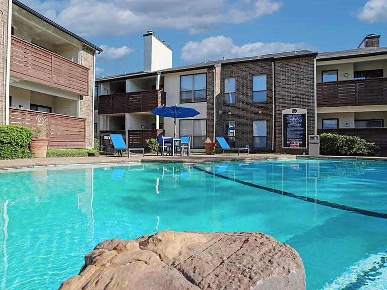 Resort-style swimming pool with crystal-clear water and spacious sundeck for relaxing and enjoying the Texas sun