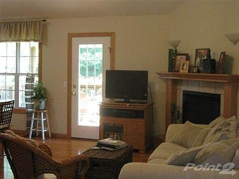 The hearth room.  The door and windows look out into the covered deck and beautiful backyard.