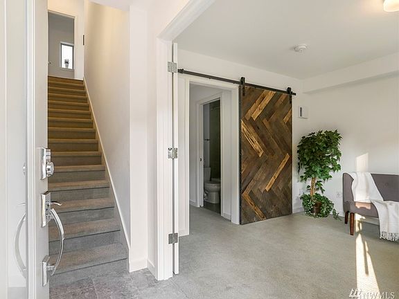 Welcome in to this spacious townhome.  There is a bedroom/office with a full bath to the right.