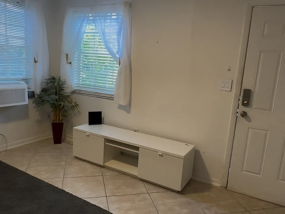 The position of the front door in reference to the living room