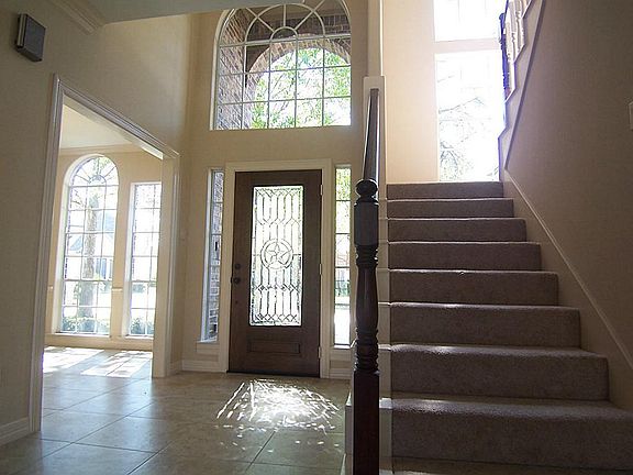 Spacious two story foyer with 20" tile.