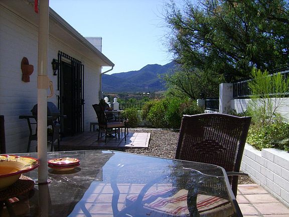 Walled patio with view of Red Mountain