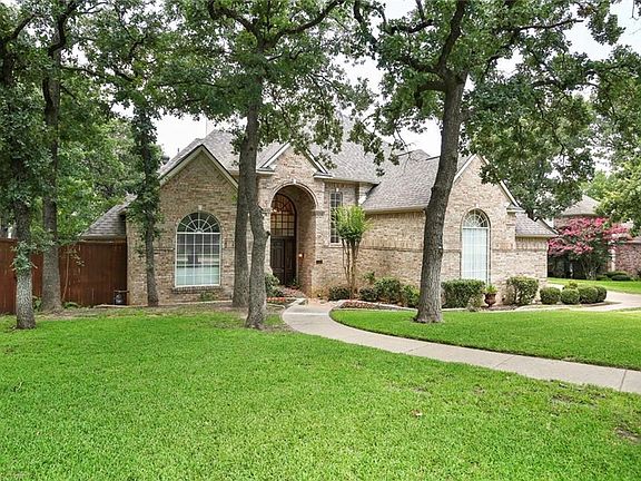 SET BACK FROM THE STREET AMONG BEAUTIFUL MATURE OAK TREES THIS HOME HAS FABULOUS CURB APPEAL!