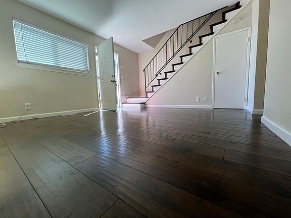 Front door entrance to the living and stair case to second floor.