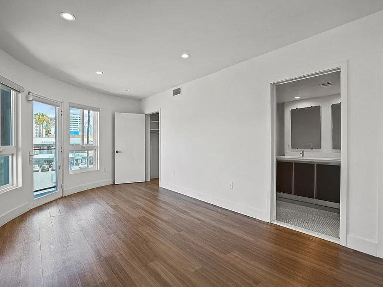 Bedroom with Bathroom, Closet, and Balcony