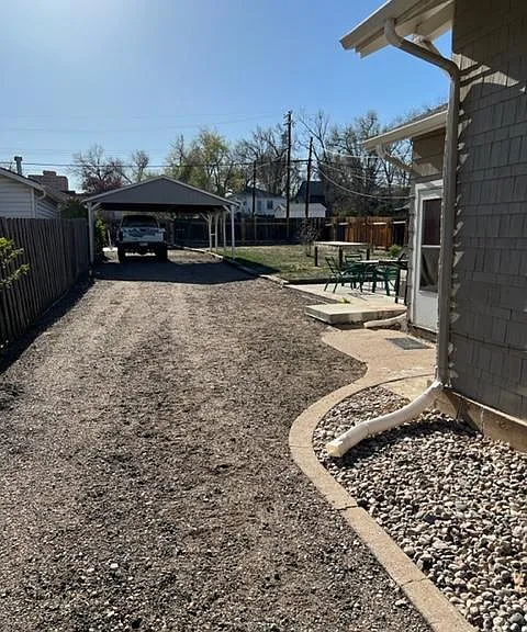 View of driveway and car port