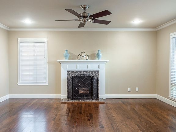 Living room fireplace and overhead fan