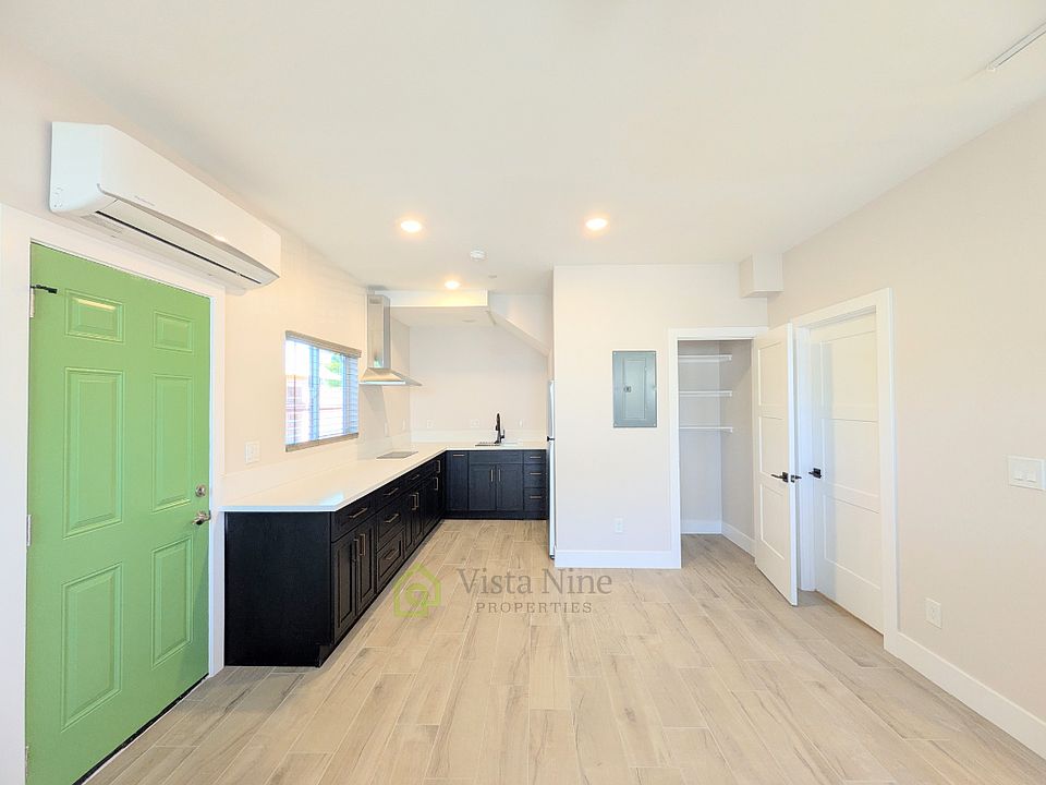 Kitchen with plenty of cabinets, pantry, mini split heater and air conditioner