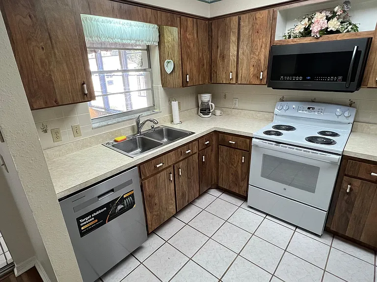 Complete kitchen with new stove and dishwasher! Microwave can broil too!