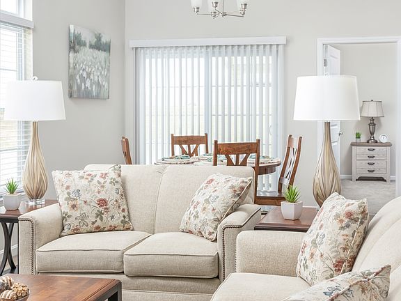 Open plan living, dining and kitchen. Vaulted ceiling, big windows and lots of natural light.