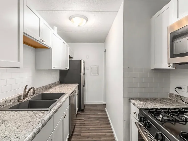 Granite, White Cabinets, and Stainless Steel Appliances