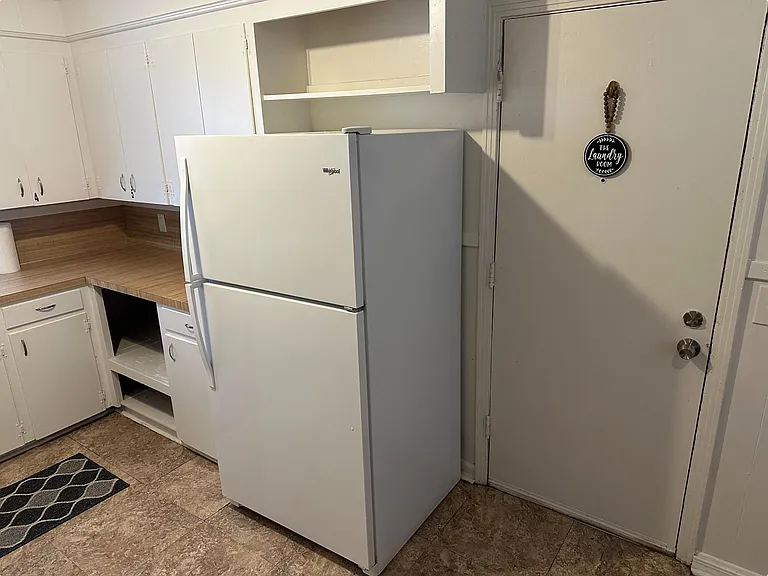 The Laundry Room where all House Guests take turns using the brand new Washer & Dryer along with a Sorting / Folding Station