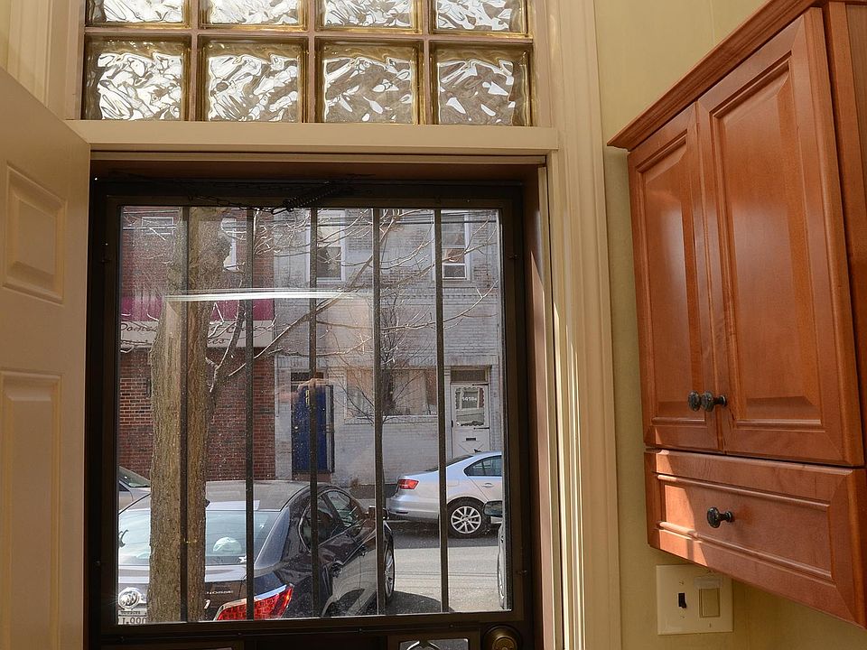 Private Mudroom entryway with security door and letter slot.