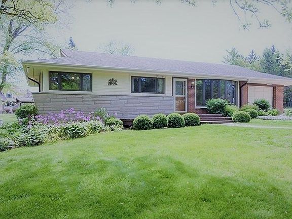 Front of the house with mature trees