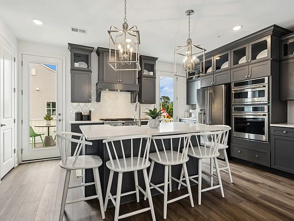 Kitchen with glass upper cabinets