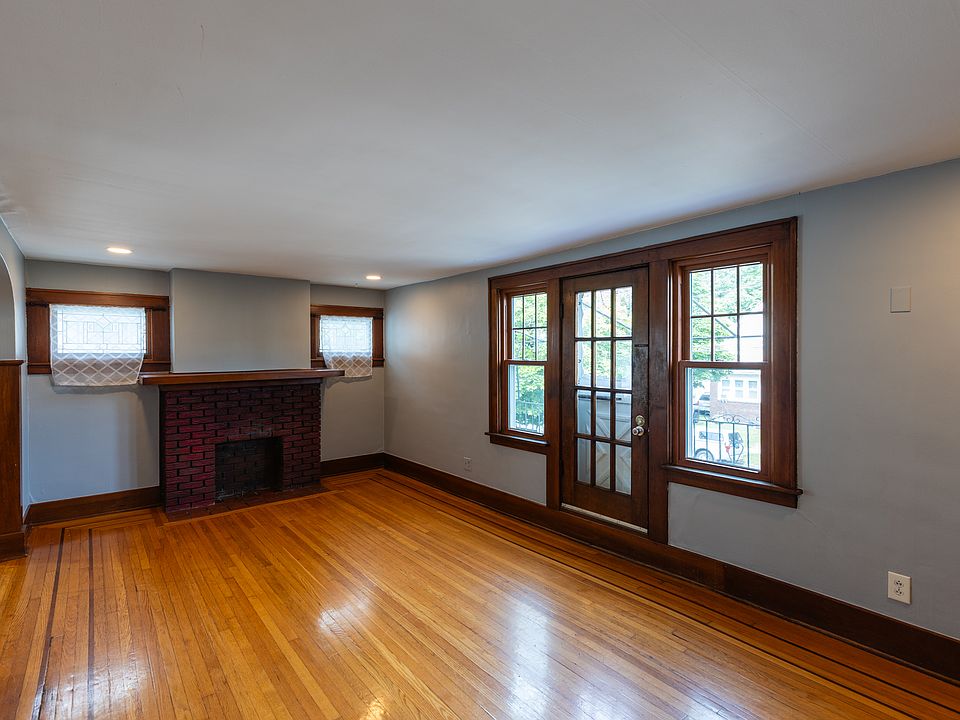 Living room, fireplace mantel, door to balcony patio