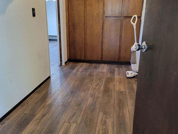 Laundry room with storage or pantry.