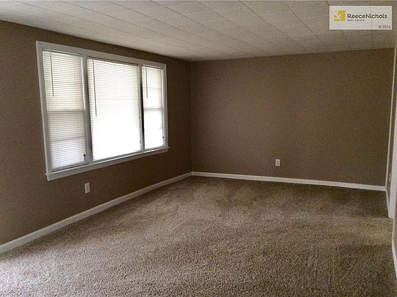 Fresh paint, new Carpet & blinds in living room.