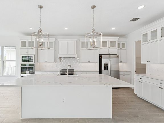 Kitchen with striking pendant lighting