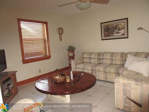 FAMILY ROOM- CERAMIC TILE FLOOR, STAINED WOODWORK, CEILING FAN