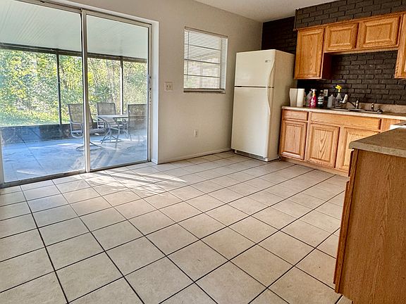 Kitchen looking on to screened back porch