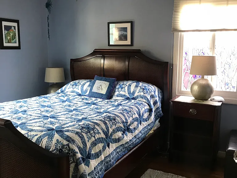 Hardwood floors and fans in bedrooms