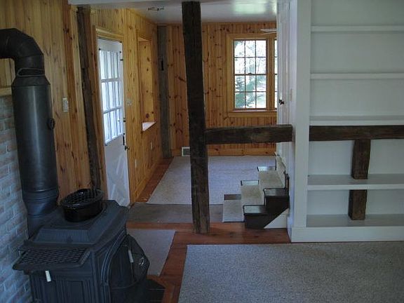 Front entry
Living room with stove
Dining room