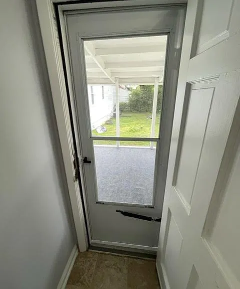 Dining room side door to screened in porch.