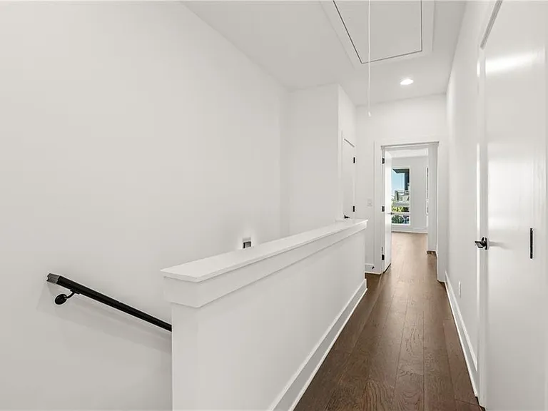 2nd Floor - Linen Closet and Washer / Dryer (Note: Actual unit has light wooden floors and upgraded fixtures / appliances)