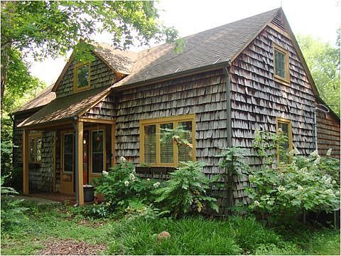 Two stories, siding is oak and cedar shakes.
