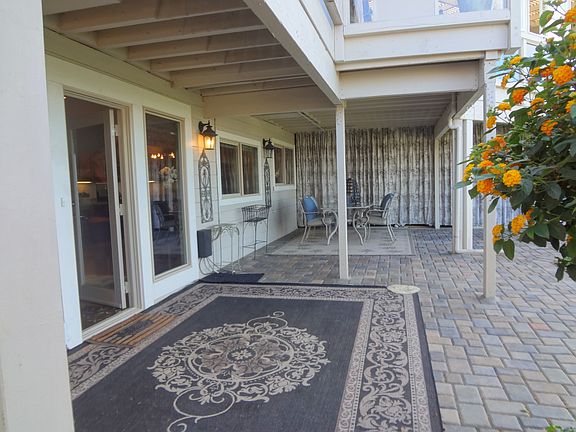 Large Front patio with outdoor table off front entrance