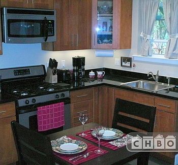 Full kitchen with granite coun