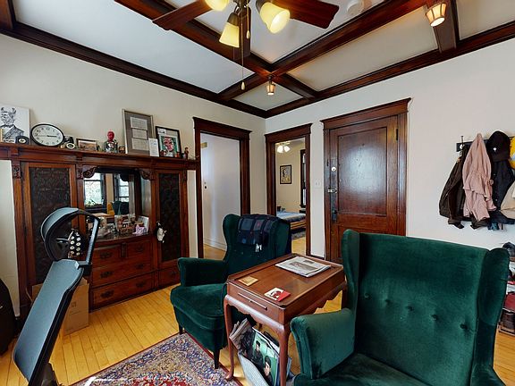 Unit 2 dining room with original built-in hutch