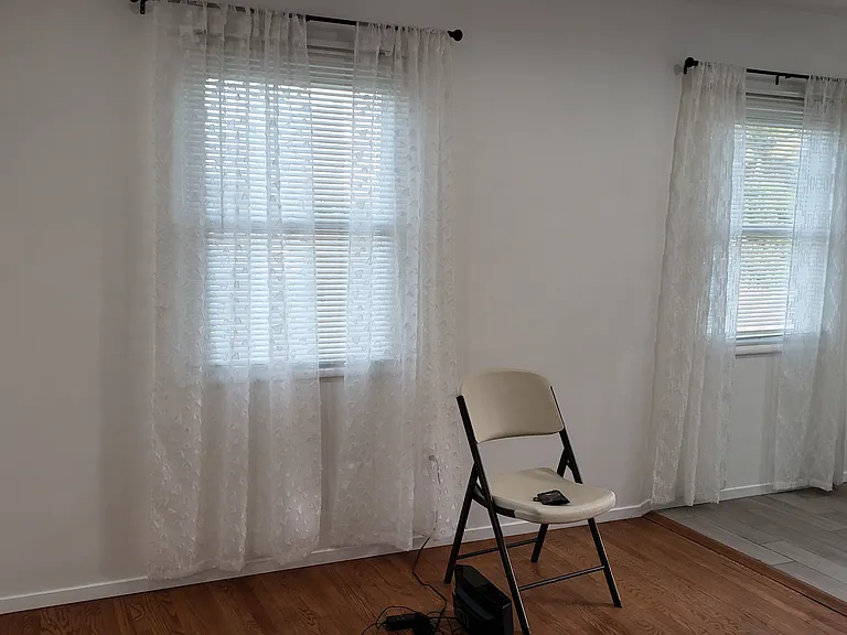 While standing in front room: Looking towards dining area, on the right.