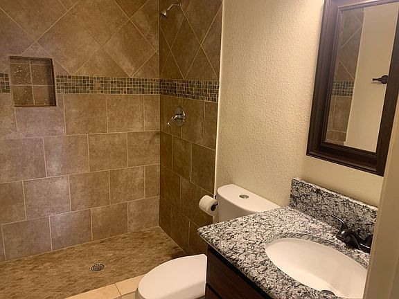 this is one of the 2 bathrooms with granite and tile