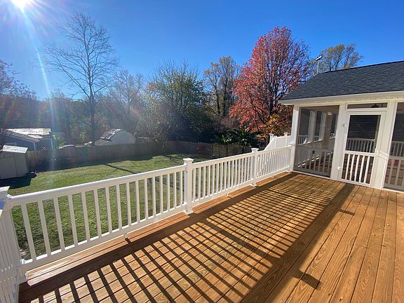 View from deck into fenced in backyard
