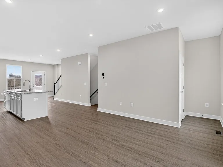 Living space with LVP flooring, open concept with kitchen and dining area