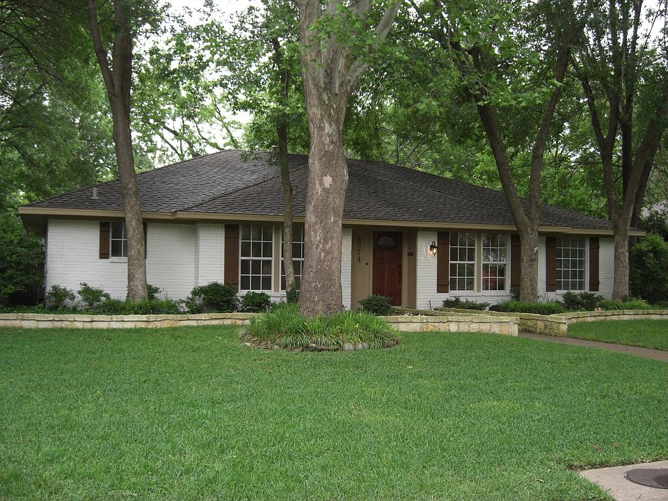 Front, tall trees, large lot