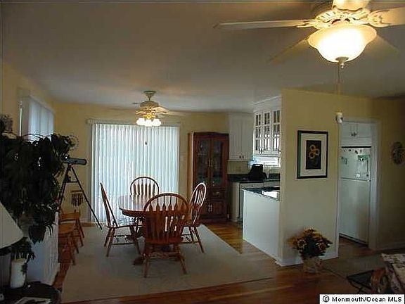 Dining Room with Sliders to Deck on Bay