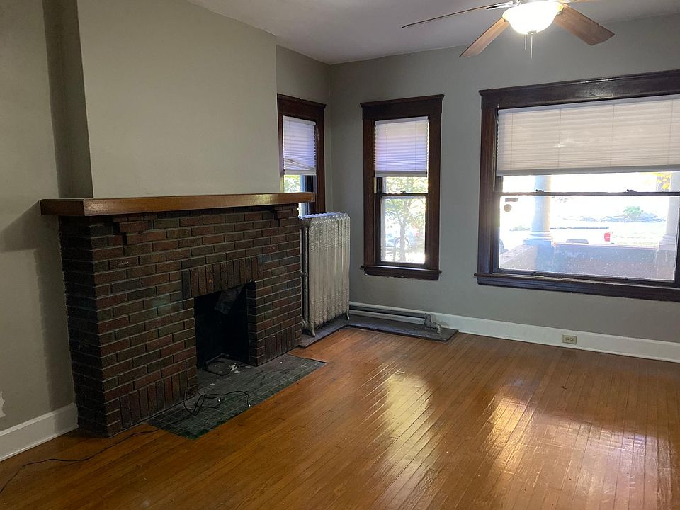 Front room with plenty of light and ceiling fan.