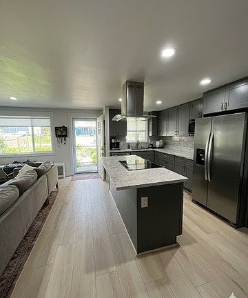 front door, kitchen to right, living to left